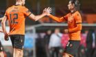 Ryan Edwards (centre) celebrates with Ian Harkes after Dundee United took the lead against Kelty Hearts.