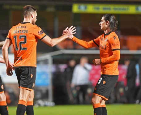 Ryan Edwards (centre) celebrates with Ian Harkes after Dundee United took the lead against Kelty Hearts.