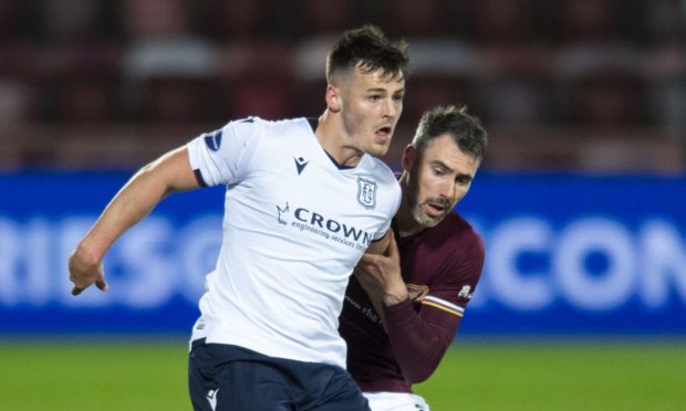 Dundee's Danny Mullen (L) holds off Hearts' Michael Smith.