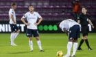 Dundee players dejected at Tynecastle.