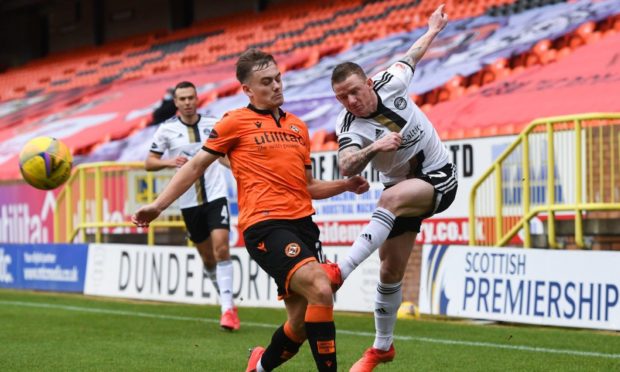 Dundee United winger Luke Bolton closes down Aberdeen man Jonny Hayes.