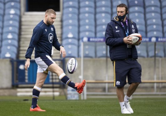 Scotland's Finn Russell (left) with assistant coach Mike Blair.