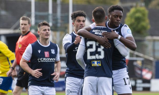 Dundee's 
Jonathan Afolabi (right) celebrates after he makes it 1-0 against Morton.