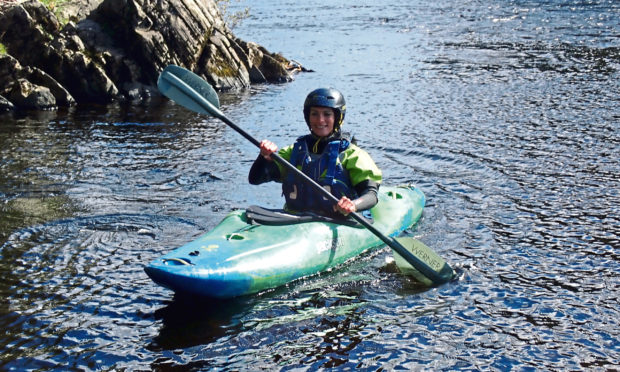 Gayle Ritchie enjoying a kayaking session on the River Spey.