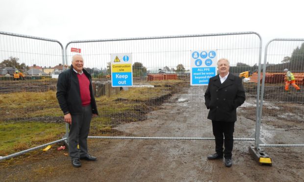Mr Caldwell, left, and SNP councillor John OBrien at the site of the care village.