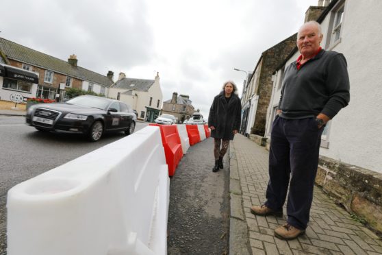 David Jerdan, chairman of Crail Community Council, with Fife Councillor Linda Holt in the High Street in Crail today, beside the new Spaces For People measures that have been introduced.