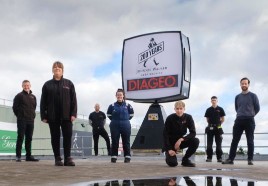 Pictured left to right are Gavin Brogan (Operations Director), Lorraine Johnstone (Longest serving employee), Jason McEvoy (Engineering Manager), Danielle O?Sullivan (Apprentice Mechanical Engineer), Kyle McLean (Apprentice Electrical Engineer), Euan Simpson (Apprentice Mechanical Engineer), Bobby Rintoul (FCE Group)
. Leven. Courtesy Diageo Date; Unknown