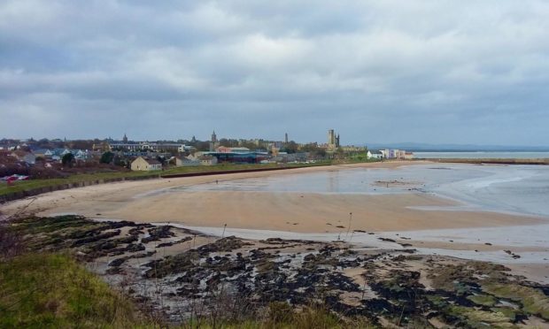 Walking along the coastal path above St Andrews