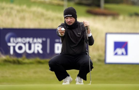 Ewen Ferguson lines up a putt on the ninth green during day one of The Scottish Championship at Fairmont St Andrews.