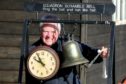 Montrose Air Station Heritage Centre chairman Stuart Archibald with the station clock and scrambling bell of the era.