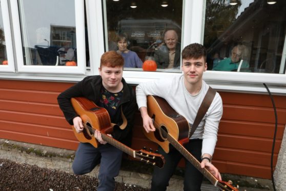 Musicians Callum Campbell and Malcolm Swan, with residents Irene Kitson, Kenneth Murray and Janet Laing.