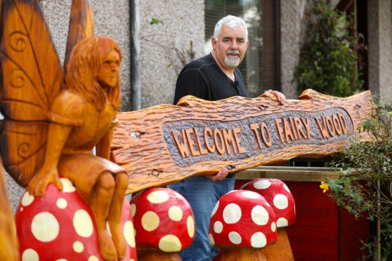 Fairy Woodland creator Derek Davidson with the latest wood carvings.
