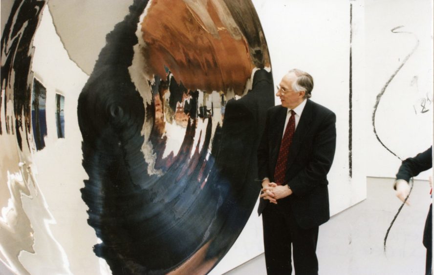 Scottish Secretary Mr Donald Dewar pauses to reflect on one of the exhibits at the opening of DCA on March 19 1999.