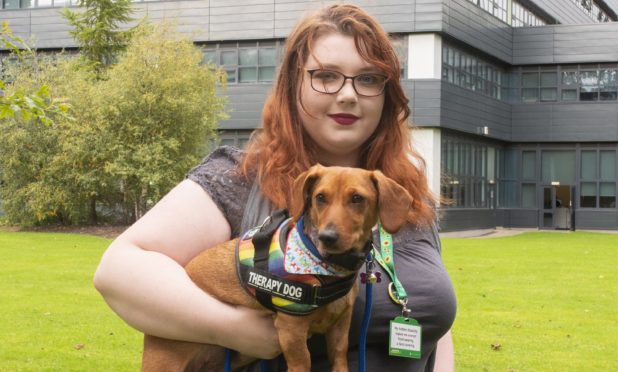 Dundee and Angus College student Isla Gray with Dachshund Belly.