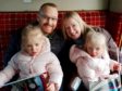 Jamie Buchanan with wife Kathryn and their twin daughters.