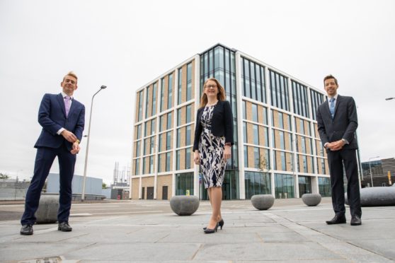 Cabinet Secretary for Social Security, Shirley-Anne Somerville (centre)  Dundee City Council leader John Alexander (right) and Chief Executive of Social Security Scotland, David Wallace, at the new headquarters.