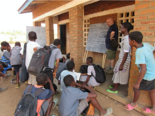 Beath High School teacher Ian Mitchell involved in lessons on plant fertilisation at Njale and Sanitation at Mapanga.