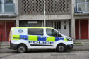 A police van outside the flats on Wednesday morning.