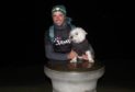 Ross and his pet dog, Dex, at the top of the final climb of East Lomond Hill at 1am.