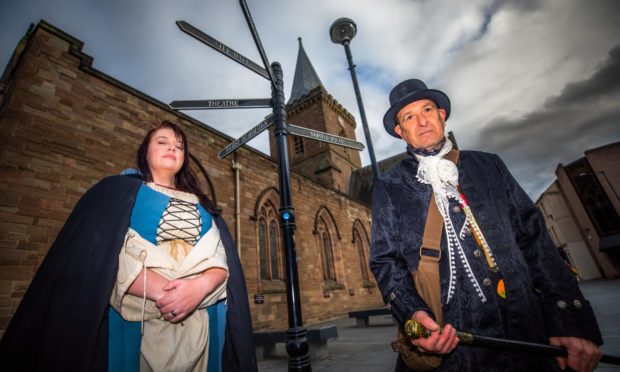 Lynne Knight (of History and Horror Tours) alongside Dave McNamara (a new member of the History and Horror Tours group) -- near St John's Kirk, St John's Place, Perth.