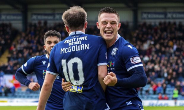 Jordan Marshall celebrates with Paul McGowan in October last year.