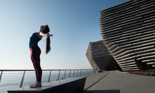 A dancer outside V&A Dundee.