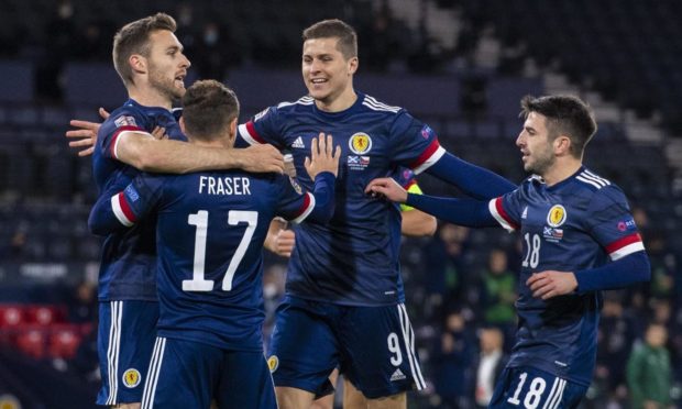 The Scots celebrate Ryan Fraser's early goal.