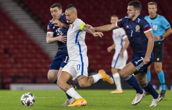 John Fleck and John McGinn in action against Slovakia.