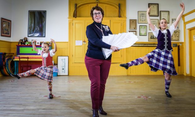 Highland Dancers Harla Masson, 6, and Rowan Walker, 17, with Angus Lord Lieutenant Pat Sawers.