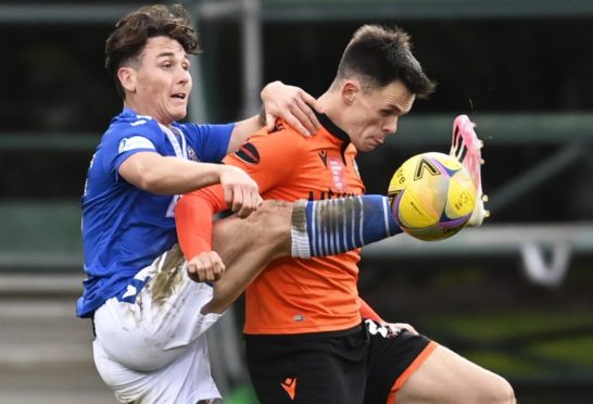 Dundee United's Lawrence Shankland fights for the ball with St Johnstone's Danny McNamara.