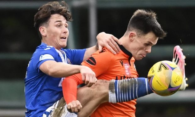 Danny McNamara challenges Lawrence Shankland.