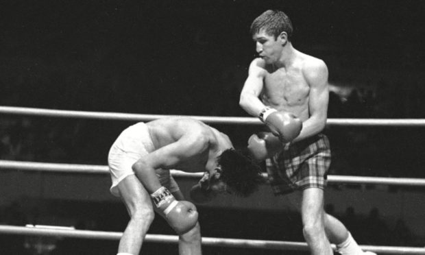 British boxer Ken Buchanan, left, fights against Mexican boxer Ruben Navarro during their championship fight at the Los Angeles Memorial Sports Arena.