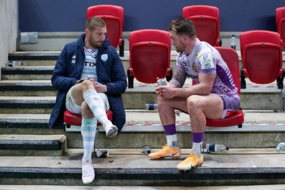 Finn Russell and Stuart Hogg share a beer after the Heineken Cup Final in Bristol.