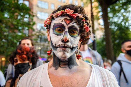 Mandatory Credit: Photo by Amy Harris/Shutterstock (10961396ac)
A protester poses for a photo at the 'Black Angels Ball' at Stonewall Inn on October 15, 2020 in New York, New York.
Protesters Gather For The 'Black Angels Ball' in NYC, New York, USA - 15 Oct 2020