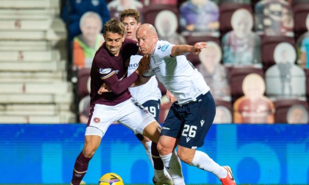 Charlie Adam battles with Olly Lee in Hearts' 6-2 win over Dundee on Friday night.