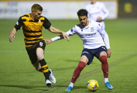 Dundee's Declan McDaid competes with Jon Robertson at the Indodrill Stadium.