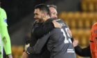 Dundee United boss Micky Mellon celebrates with keeper Deniz Mehmet.
