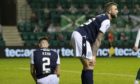 Dundee players are dejected after falling behind at Hibernian.