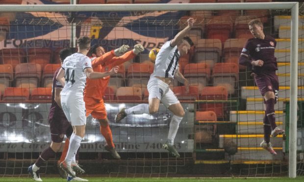 Dunfermline captain Euan Murray nods home his side's second of the evening.