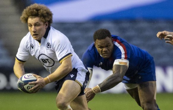 Duncan Weir drives forward away  from France's Virimi Vakatawa.