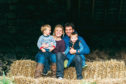 Eilidh in the steading with her husband Craig and their sons Jack, three, and Andrew, one.