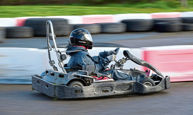 Gayle whizzes round the track at Lochter in a go kart.