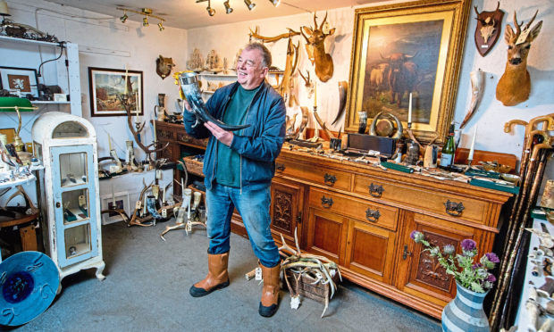 John Lacey, one of a handful of horn/antler carvers in Scotland, at his shop in Lawers, Perthshire.