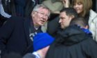 Sir Alex Ferguson chats to St Johnstone chairman Steve Brown in the McDiarmid Park directors' box..