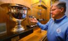 Bill Thompson of Carnoustie Golf Club with the Los Angeles Open trophy and medals from 1928, 29, 32 and '34, at Carnoustie Golf Club.