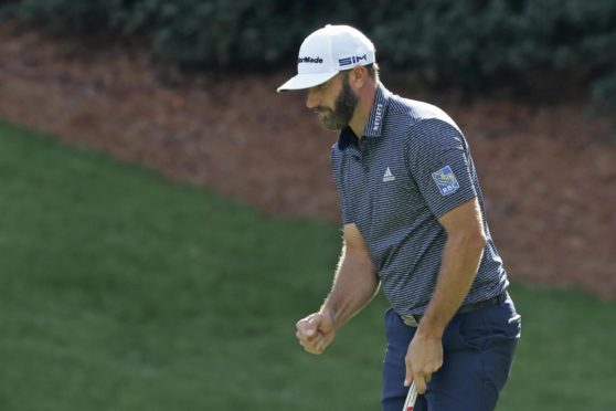 Dustin Johnson gives his usual muted reaction to a birdie at 13 on his way to his Masters win.