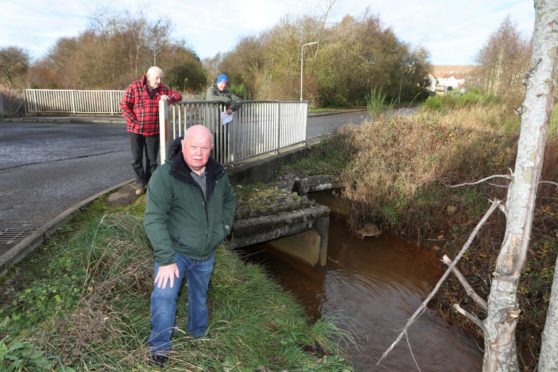 Kinglassie residents John Laing , Dave Murray and Jim Rankin are calling for more to be done to prevent further flooding from Lochty Burn.