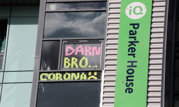 Abertay students put lockdown signs in their windows at Parker House, Dundee, during an outbreak.