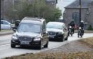 The funeral of engineer Simon Linford took place in Meigle with a convoy of vintage motorcycles escorting the hearse through the streets.