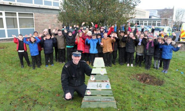 The Strathmore pupils dropped one of the winter walk trees off with Forfar PC Scott Anderson.